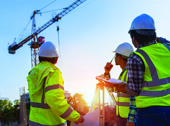 bigstock-construction-engineers-discuss-288921430.jpg